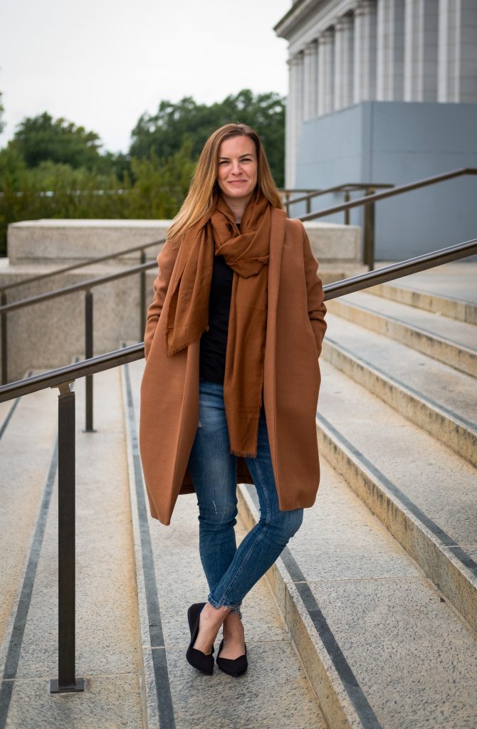 Andrea Mooney ’08 standing on a staircase outside | Photo by Derek Palmer