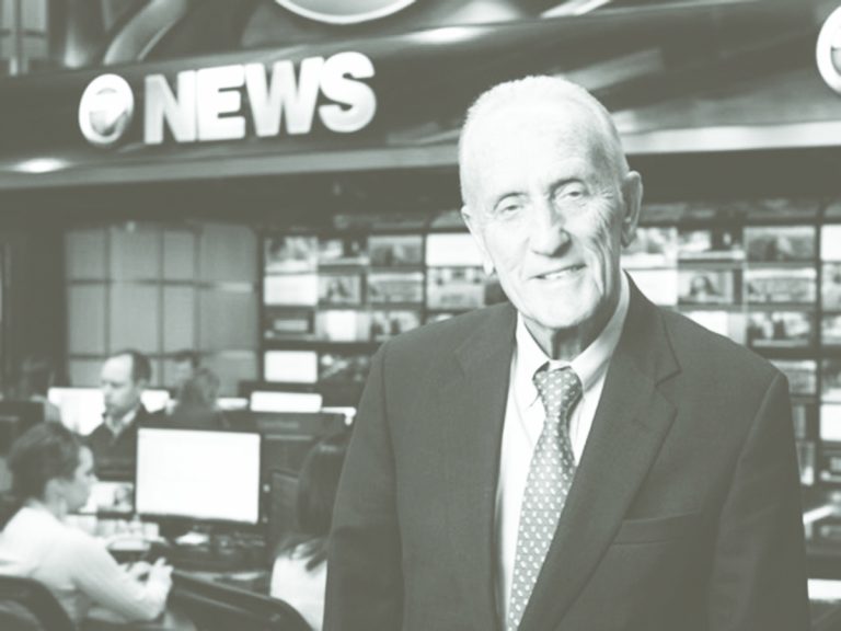 Edmund Ansin in a news studio