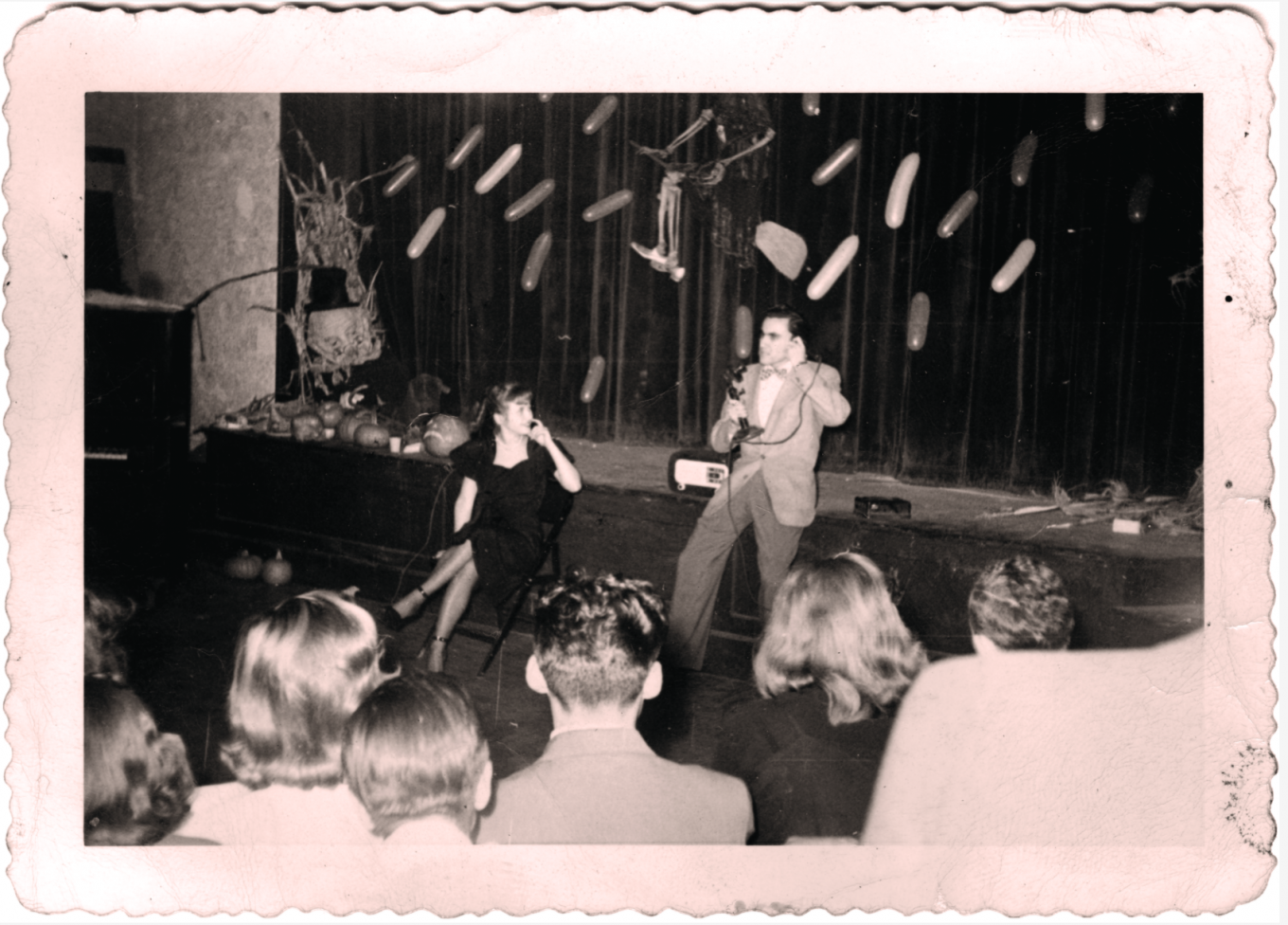 Bill Dana '50 on stage performing during a Halloween event