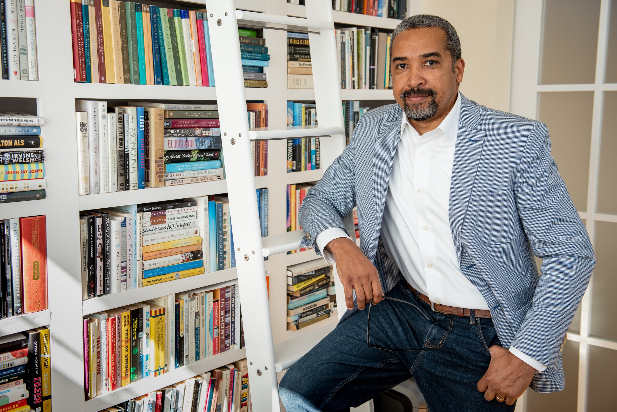 Portrait of Jerald walker sitting in office in front of a bookshelf