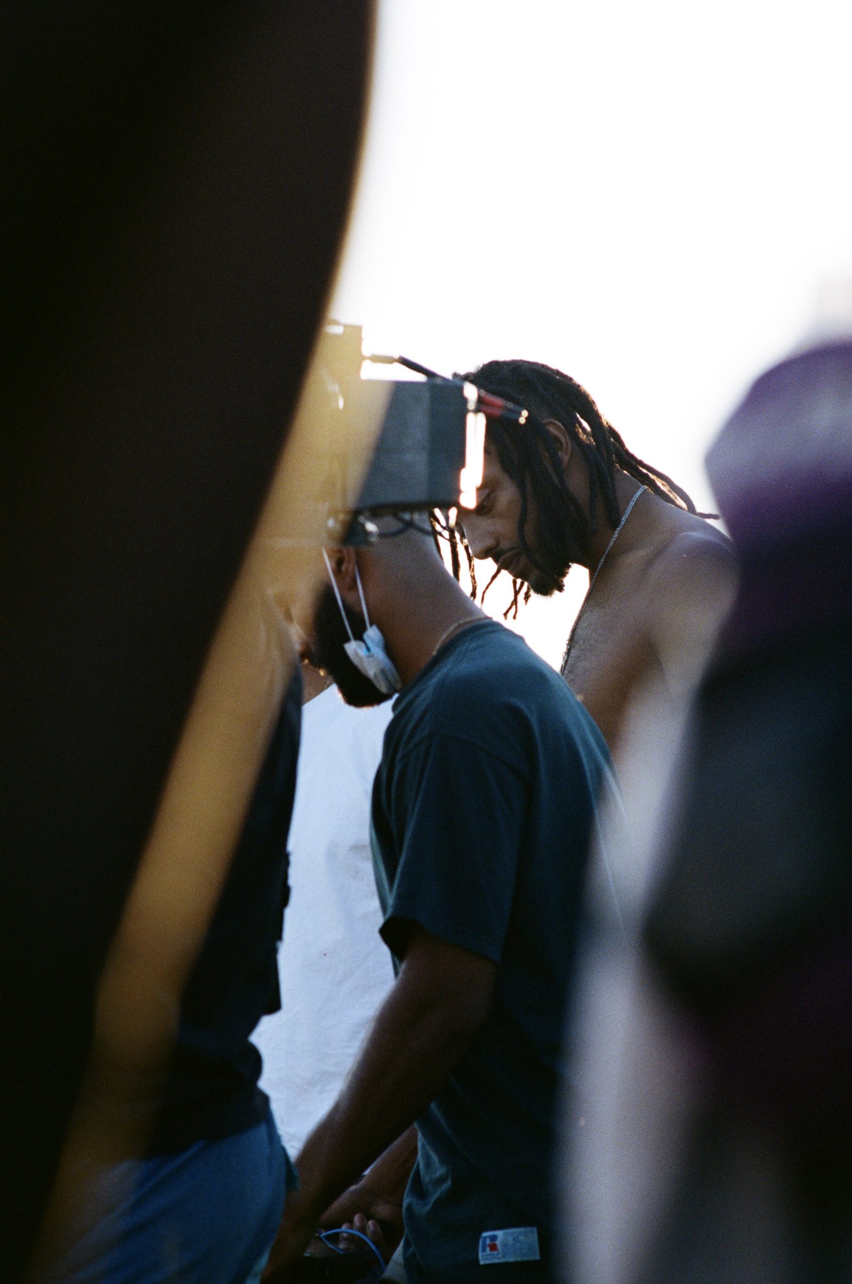 Aminé and director Phillip Youmans watching a take at Big Bear Lake.