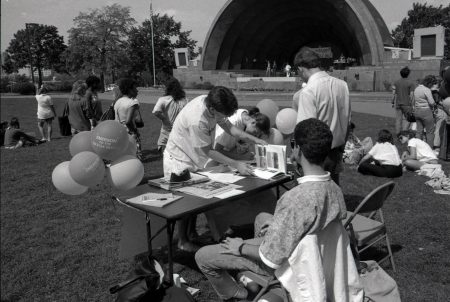 Black and white vintage photo of a student org fair in front of the Hatch Shell on the Esplanade