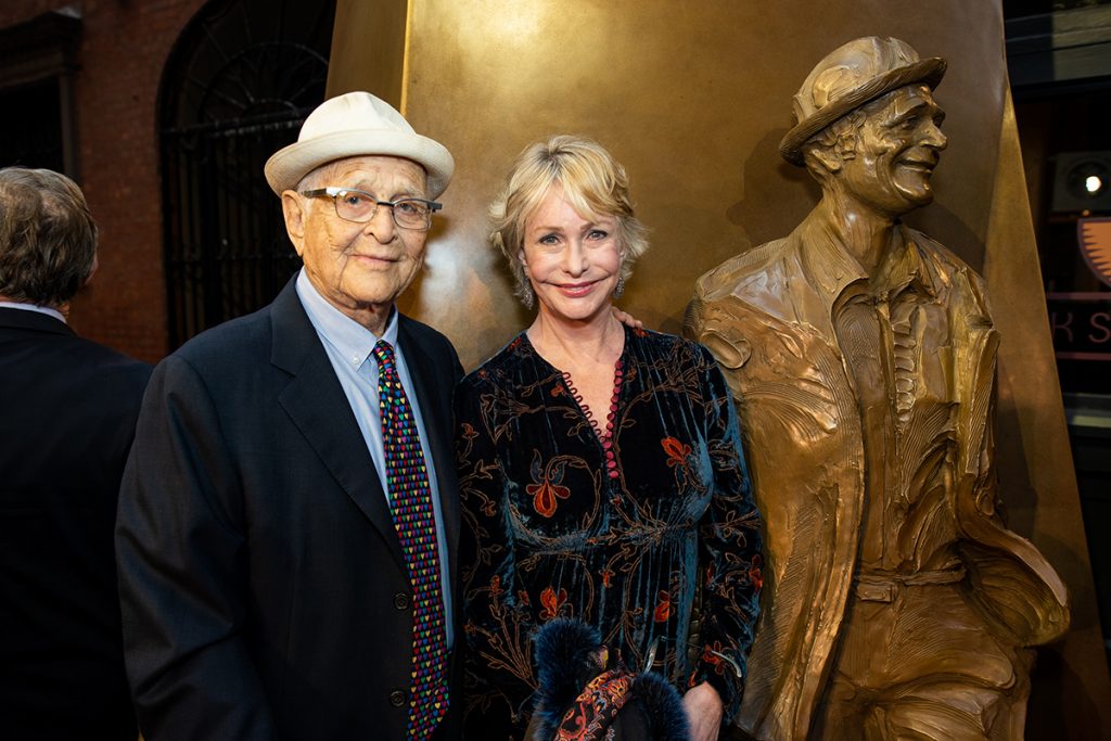 Norman and Lyn Davis Lear by the statue of Norman in Boylston Place