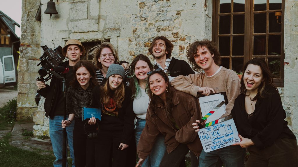 A group of students smile together