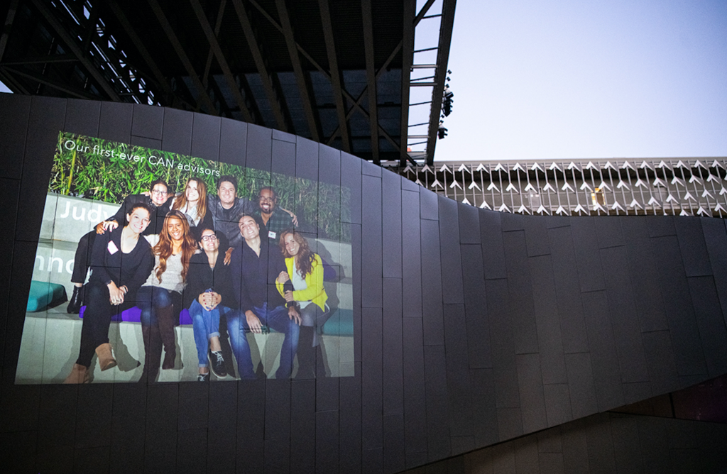 A slideshow during the event shows a photo from the first semester of the Career Advisory Network