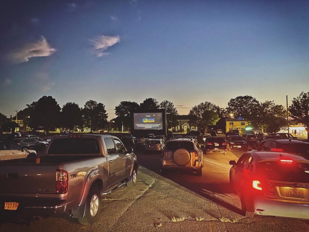 200 cars lined up for a drive-in experience featuring contemporary digital, video, and light art, presented by Emerson Contemporary and AREA CODE on August 14, 2020