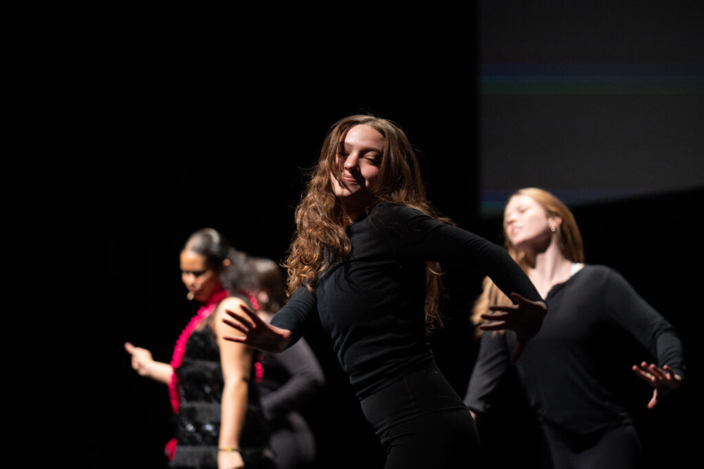 A woman dances on stage