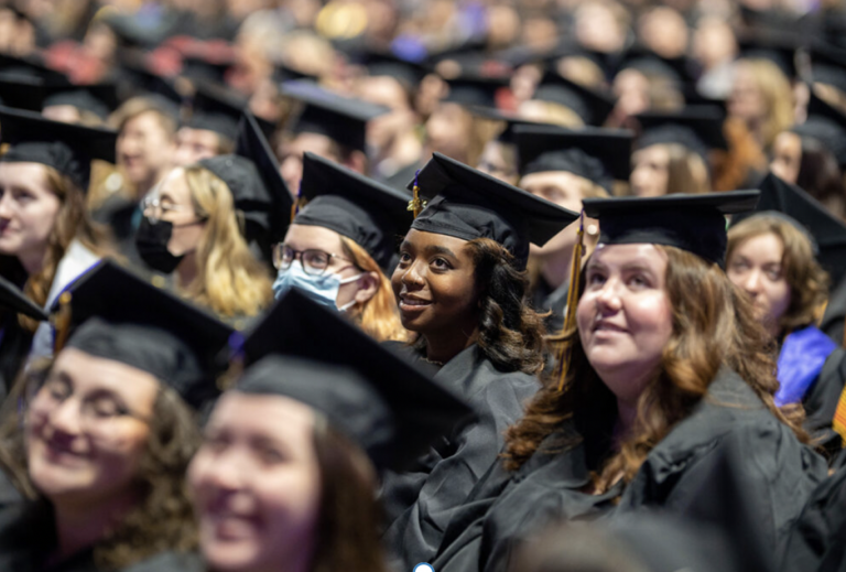 A sea of students in graduation robes