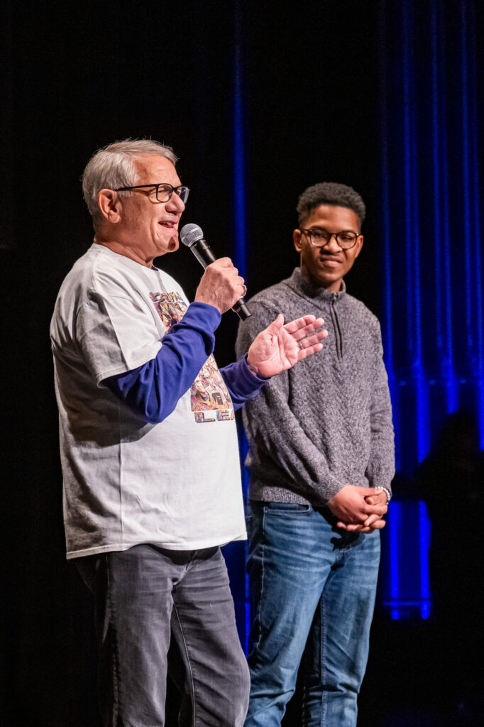 Kevin Bright and Dylan Humphrey talk on a stage