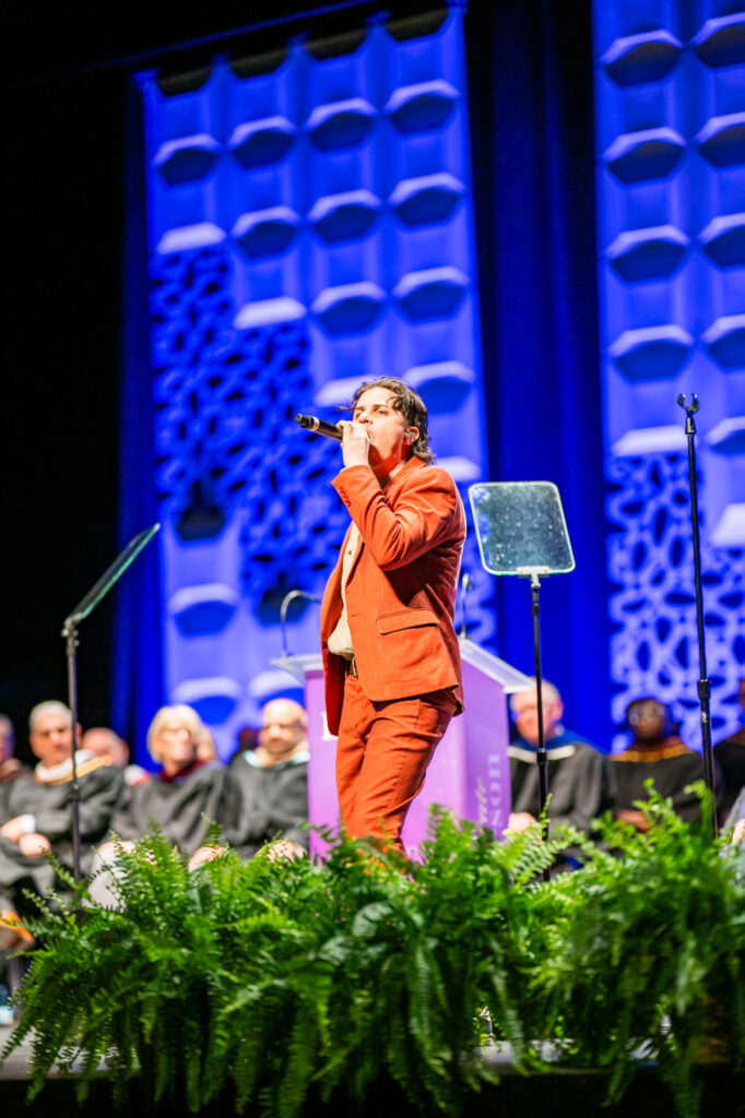 George Watsky performs on stage