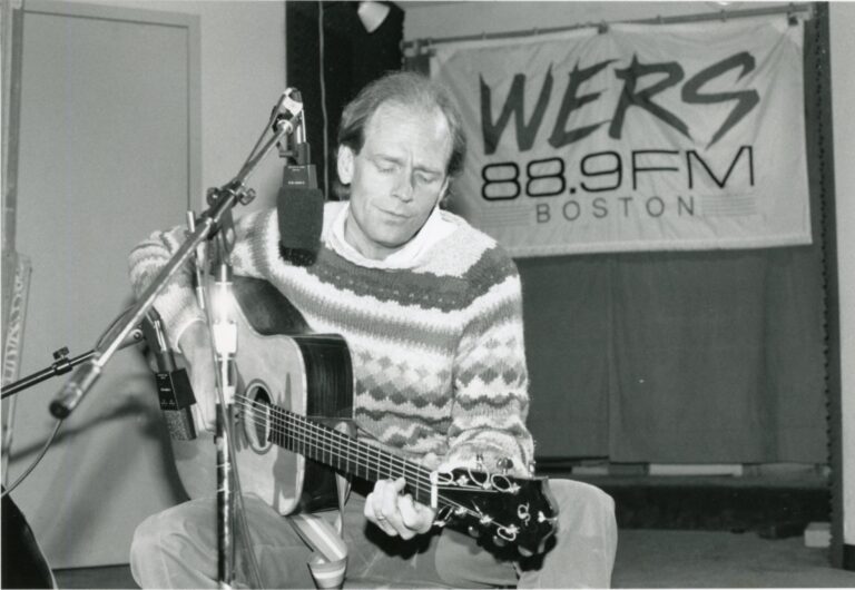 Livingston Taylor playing guitar